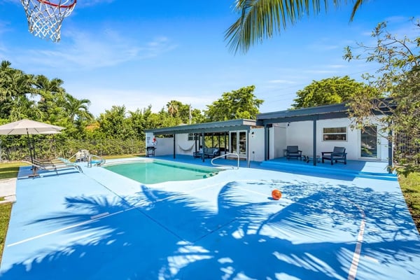 Backyard pool and basketball court at a Sea Turtle property